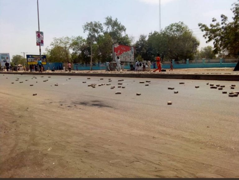 Residents destroy APC billboards to protest Buhari’s visit to Kano